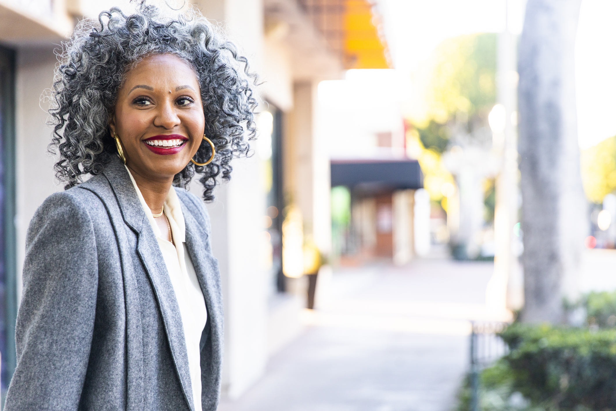 A Carefree Black Woman Looking Back Over her Shoulder